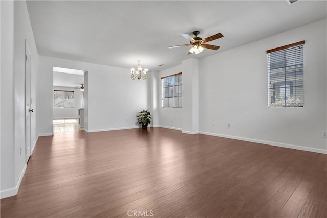 62 Rio Grande St, Fillmore, CA 93015 - empty room with a ceiling fan, a chandelier, wood finished floors, and baseboards