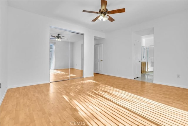 62 Rio Grande St, Fillmore, CA 93015 - unfurnished bedroom with light wood-style floors, a closet, baseboards, connected bathroom, and ceiling fan