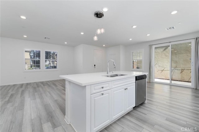 7453 Jersey St, Chino, CA 91708 - kitchen with stainless steel dishwasher, a sink, light countertops, an island with sink, and recessed lighting