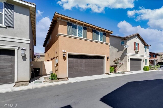 7453 Jersey St, Chino, CA 91708 - multi unit property with an attached garage, stucco siding, and a residential view