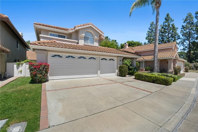 3 Andria, Irvine, CA 92614 - mediterranean / spanish-style home featuring concrete driveway, a garage, stucco siding, a tile roof, and a front lawn