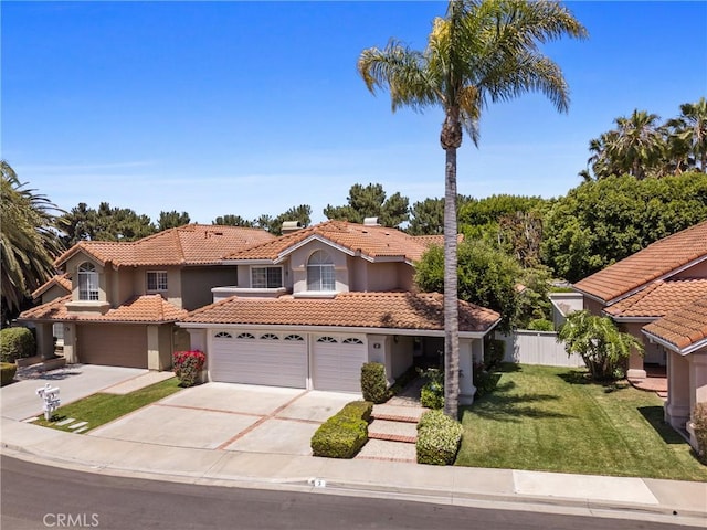 3 Andria, Irvine, CA 92614 - mediterranean / spanish house with a tile roof, concrete driveway, stucco siding, and an attached garage