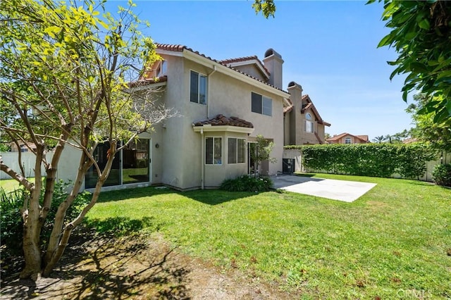 3 Andria, Irvine, CA 92614 - back of property with a chimney, a patio, stucco siding, and a tiled roof
