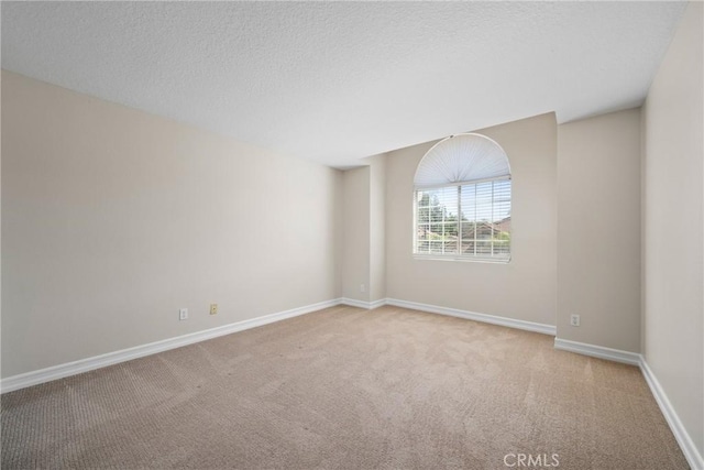 3 Andria, Irvine, CA 92614 - spare room with carpet, baseboards, and a textured ceiling