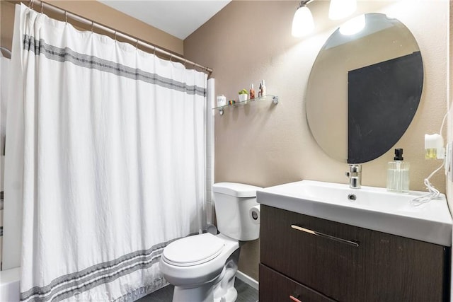 26873 Claudette St Unit 112, Canyon Country, CA 91351 - bathroom with toilet, vanity, and a textured wall