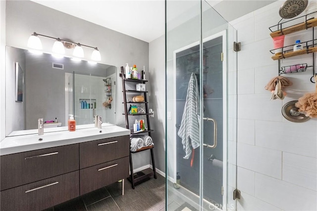26873 Claudette St Unit 112, Canyon Country, CA 91351 - bathroom with double vanity and a stall shower