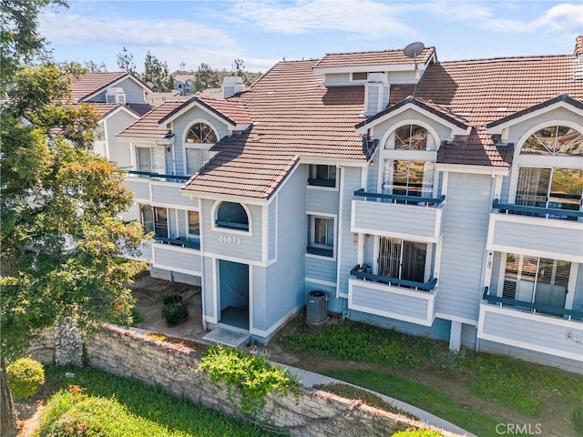 26873 Claudette St Unit 112, Canyon Country, CA 91351 - view of building exterior with cooling unit