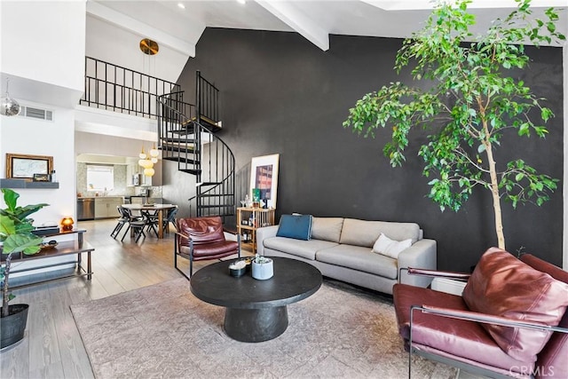 26873 Claudette St Unit 112, Canyon Country, CA 91351 - living room with stairs, high vaulted ceiling, beamed ceiling, and wood finished floors