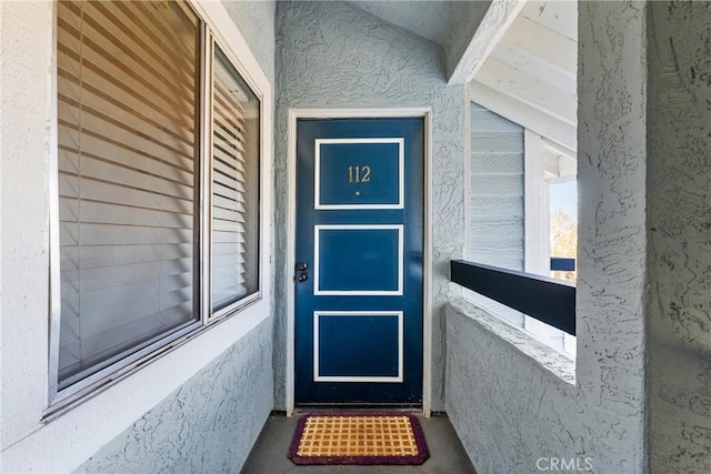 26873 Claudette St Unit 112, Canyon Country, CA 91351 - view of exterior entry featuring stucco siding