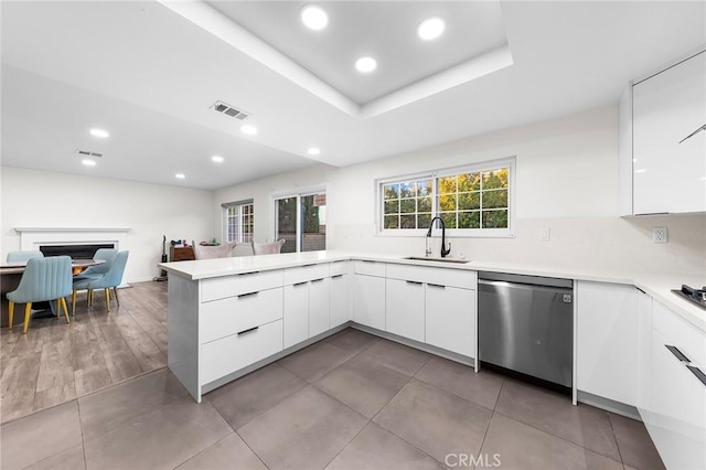 19519 Greenwillow Ln, Rowland Heights, CA 91748 - kitchen featuring stainless steel dishwasher, a sink, modern cabinets, white cabinetry, and recessed lighting