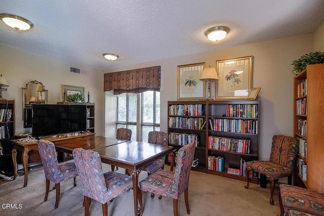 631 Wilcox Ave Unit 2E, Los Angeles, CA 90004 - carpeted dining space featuring a textured ceiling