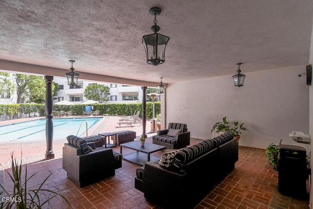 631 Wilcox Ave Unit 2E, Los Angeles, CA 90004 - view of patio with an outdoor hangout area and a community pool