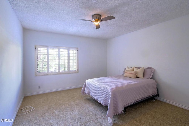 631 Wilcox Ave Unit 2E, Los Angeles, CA 90004 - carpeted bedroom with a textured ceiling, a ceiling fan, and baseboards