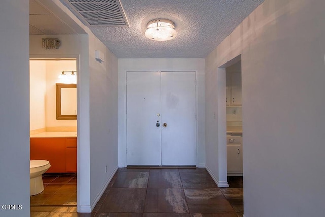 631 Wilcox Ave Unit 2E, Los Angeles, CA 90004 - hallway featuring a textured ceiling