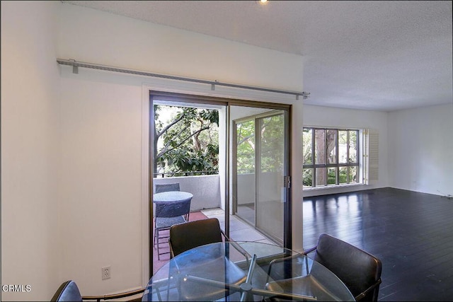 631 Wilcox Ave Unit 2E, Los Angeles, CA 90004 - dining space with a textured ceiling and hardwood / wood-style floors