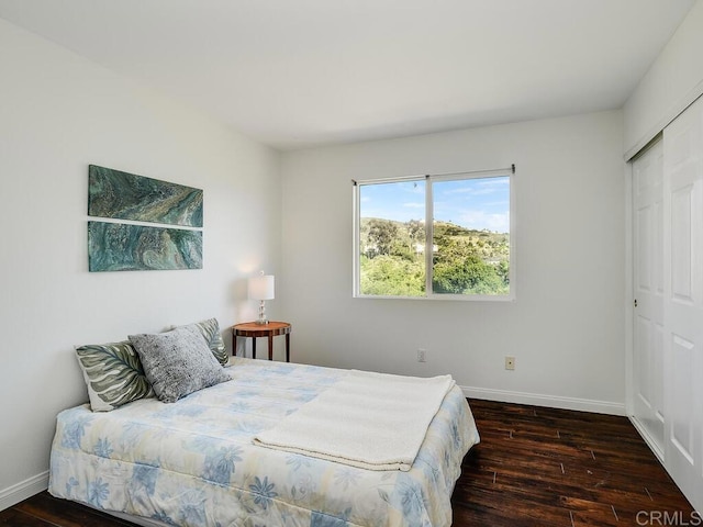 11615 Trailbrook Ln, San Diego, CA 92128 - bedroom featuring wood finished floors, baseboards, and a closet