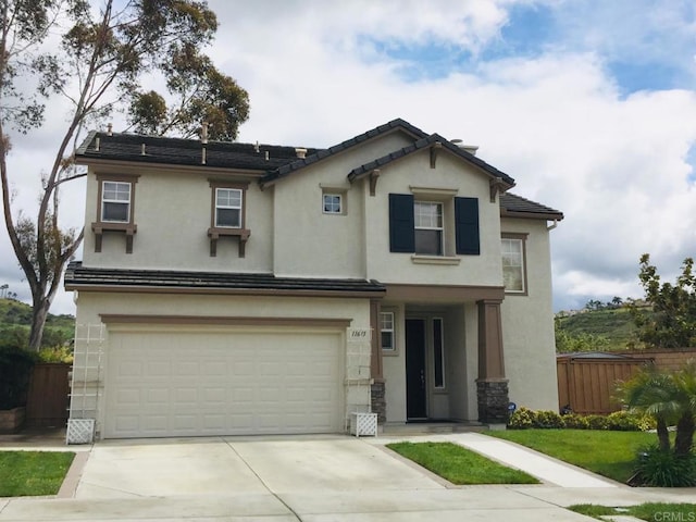 11615 Trailbrook Ln, San Diego, CA 92128 - view of front of property featuring stucco siding, driveway, and a garage