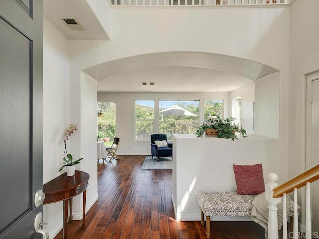11615 Trailbrook Ln, San Diego, CA 92128 - corridor with hardwood / wood-style flooring, arched walkways, and baseboards