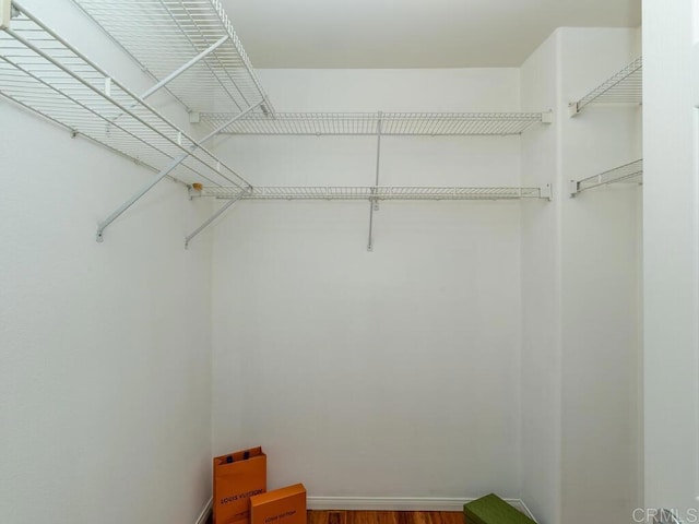 11615 Trailbrook Ln, San Diego, CA 92128 - walk in closet with wood finished floors