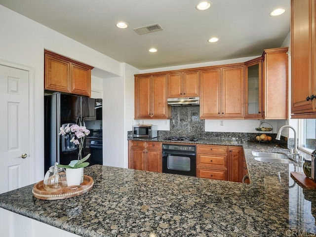 11615 Trailbrook Ln, San Diego, CA 92128 - kitchen featuring black appliances, a sink, under cabinet range hood, dark stone countertops, and recessed lighting