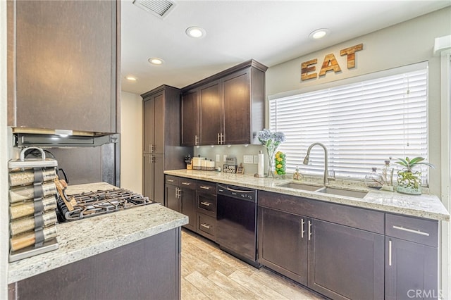 44156 30th St W, Lancaster, CA 93536 - kitchen with black dishwasher, a sink, dark brown cabinetry, light wood finished floors, and recessed lighting