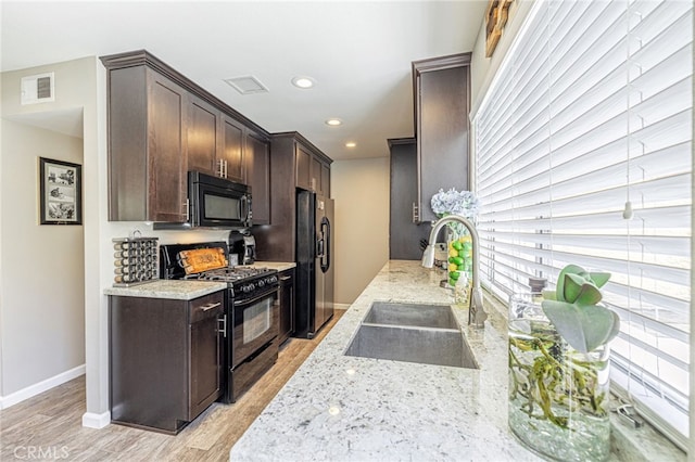 44156 30th St W, Lancaster, CA 93536 - kitchen with black appliances, a sink, dark brown cabinetry, baseboards, and recessed lighting