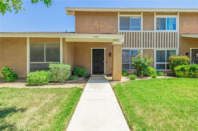 44156 30th St W, Lancaster, CA 93536 - view of property featuring stucco siding and a front yard
