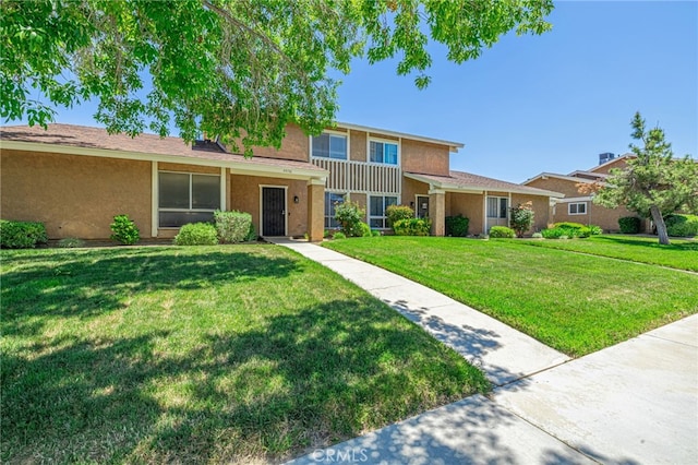 44156 30th St W, Lancaster, CA 93536 - traditional-style house with stucco siding and a front lawn