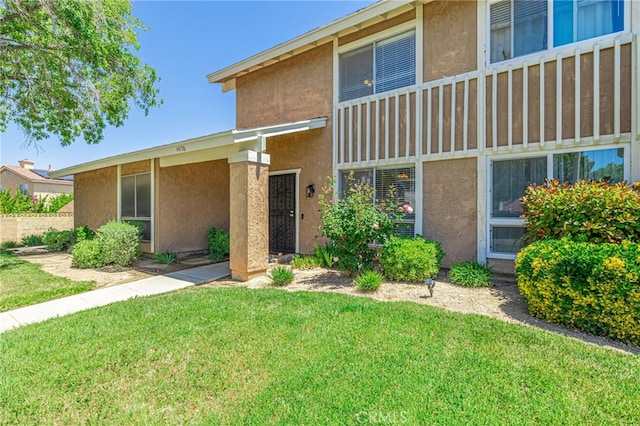 44156 30th St W, Lancaster, CA 93536 - view of front of house featuring stucco siding and a front lawn