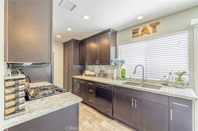 44156 30th St W, Lancaster, CA 93536 - kitchen featuring dishwasher, a sink, dark brown cabinetry, light wood-type flooring, and recessed lighting