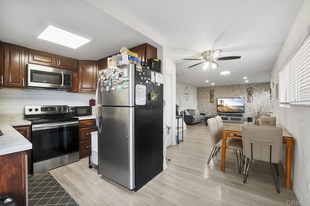 1450 Melrose Ave Unit 25, Chula Vista, CA 91911 - kitchen featuring stainless steel appliances, ceiling fan, light countertops, tasteful backsplash, and light wood-style floors