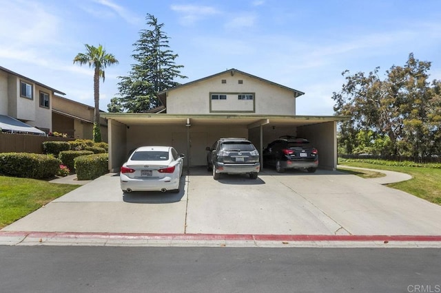 1450 Melrose Ave Unit 25, Chula Vista, CA 91911 - traditional-style home featuring an attached carport, concrete driveway, and stucco siding
