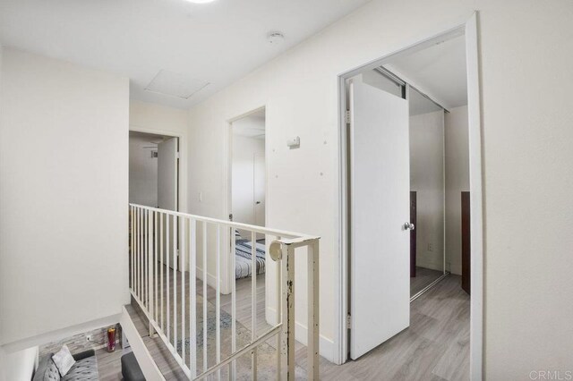 1450 Melrose Ave Unit 25, Chula Vista, CA 91911 - hallway featuring wood finished floors and attic access
