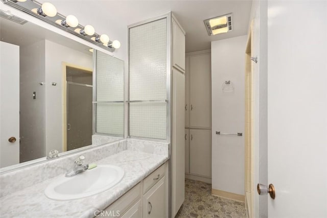542 Via Estrada Unit A, Laguna Woods, CA 92637 - bathroom featuring vanity and an enclosed shower