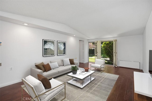 542 Via Estrada Unit A, Laguna Woods, CA 92637 - living area with wood finished floors, vaulted ceiling, baseboards, and recessed lighting