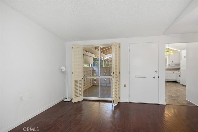 542 Via Estrada Unit A, Laguna Woods, CA 92637 - empty room featuring baseboards and wood finished floors