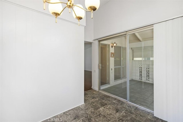 542 Via Estrada Unit A, Laguna Woods, CA 92637 - unfurnished room featuring a chandelier