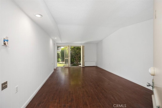 542 Via Estrada Unit A, Laguna Woods, CA 92637 - unfurnished living room with wood finished floors and baseboards