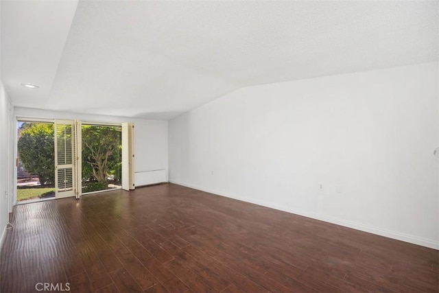 542 Via Estrada Unit A, Laguna Woods, CA 92637 - unfurnished living room with lofted ceiling, baseboards, wood finished floors, and recessed lighting