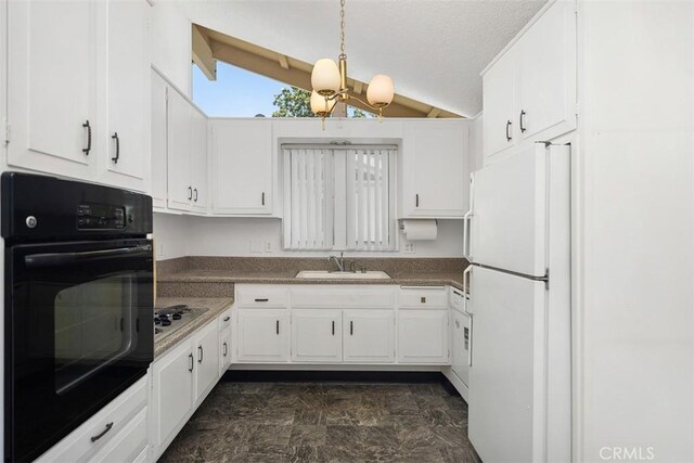 542 Via Estrada Unit A, Laguna Woods, CA 92637 - kitchen with oven, freestanding refrigerator, a sink, white cabinetry, and a textured ceiling