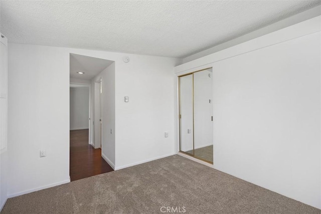 542 Via Estrada Unit A, Laguna Woods, CA 92637 - unfurnished room with carpet flooring and a textured ceiling