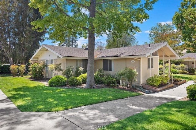 542 Via Estrada Unit A, Laguna Woods, CA 92637 - view of front facade featuring a front lawn and stucco siding