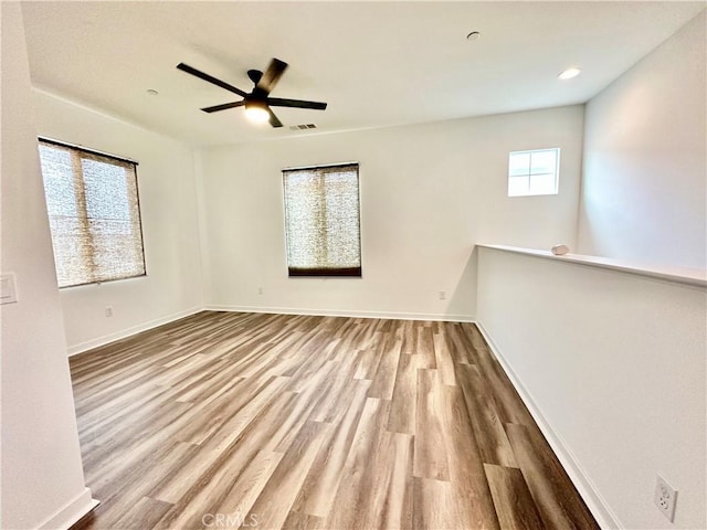 403 Aura Dr, Costa Mesa, CA 92626 - unfurnished room featuring wood finished floors, baseboards, and ceiling fan
