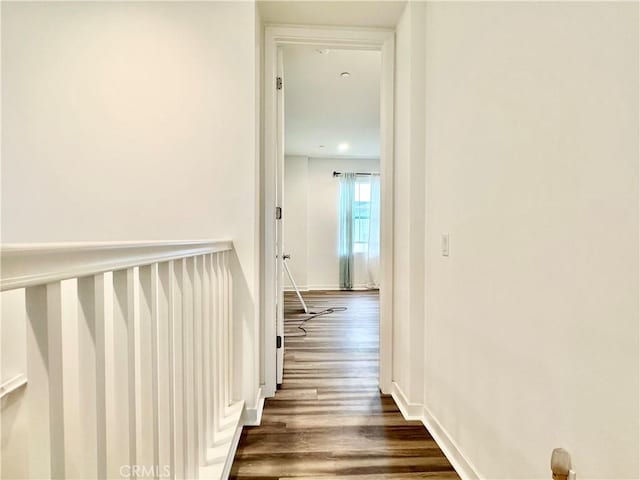 403 Aura Dr, Costa Mesa, CA 92626 - hall featuring dark wood-style flooring and baseboards