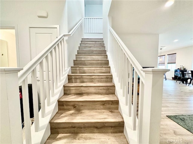 403 Aura Dr, Costa Mesa, CA 92626 - stairs featuring wood finished floors and recessed lighting