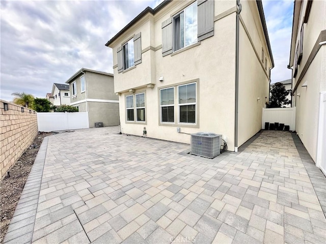 403 Aura Dr, Costa Mesa, CA 92626 - fenced backyard featuring a patio area and central AC unit