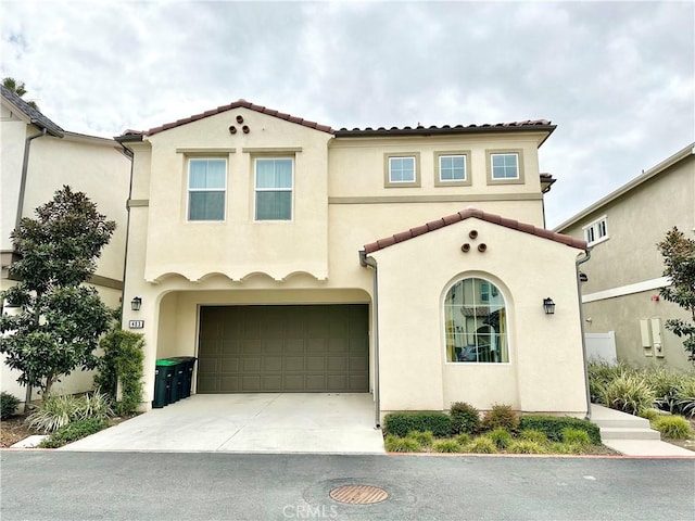 403 Aura Dr, Costa Mesa, CA 92626 - mediterranean / spanish house with driveway, stucco siding, and a garage