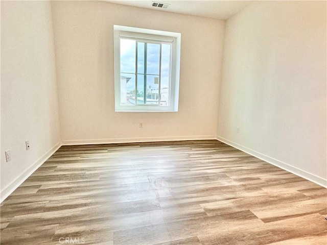 403 Aura Dr, Costa Mesa, CA 92626 - spare room with wood finished floors and baseboards