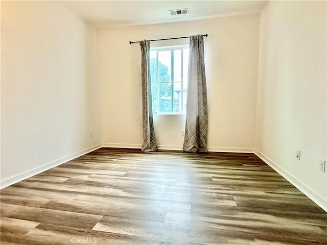 403 Aura Dr, Costa Mesa, CA 92626 - spare room featuring wood finished floors and baseboards