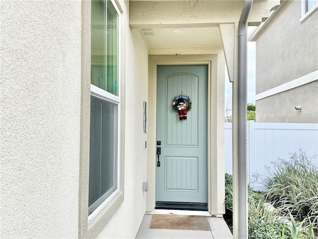 403 Aura Dr, Costa Mesa, CA 92626 - view of exterior entry featuring stucco siding